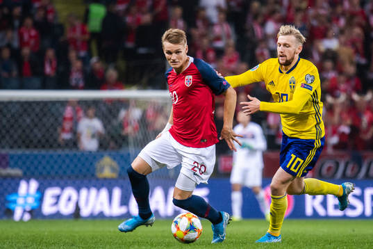 Martin Ødegaard of Norway and Emil Forsberg of Sweden