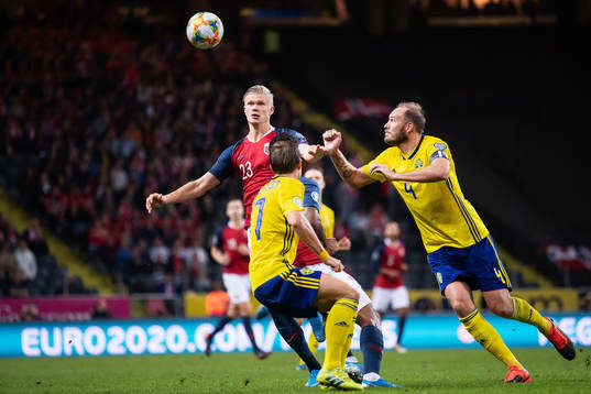 Erling Braut Haaland of Norway against Pierre Bengtsson and