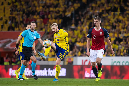 Emil Forsberg of Sweden and Markus Henriksen of Norway