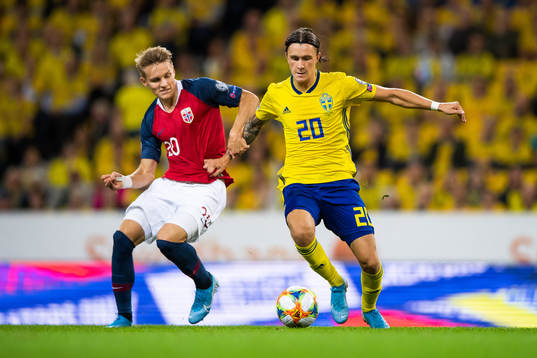 Martin Ødegaard of Norway and Kristoffer Olsson of Sweden
