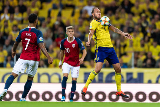 Tarik Elyounoussi of Norway and Andreas Granqvist of Sweden