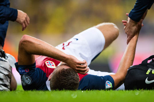Markus Henriksen of Norway lies down due to injury