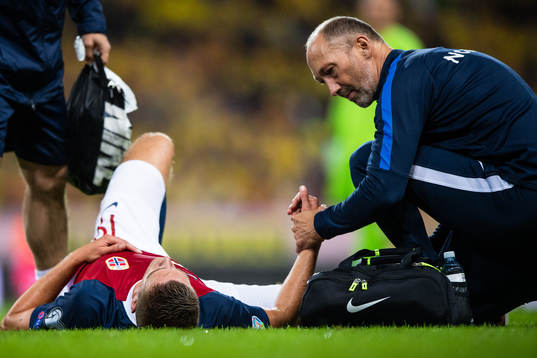 Markus Henriksen of Norway lies down due to injury