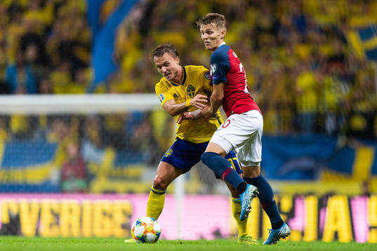 Pierre Bengtsson of Sweden compete for the ballwith Martin
