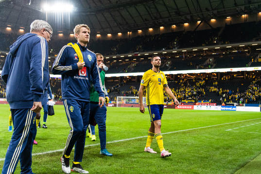 Filip Helander and Marcus Berg of Sweden look dejected as