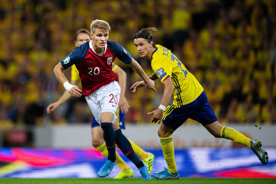 Martin Ødegaard of Norway and Kristoffer Olsson of Sweden