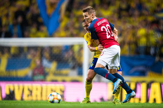 Pierre Bengtsson of Sweden compete for the ball with Martin