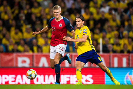 Erling Braut Haaland of Norway and Albin Ekdal of Sweden