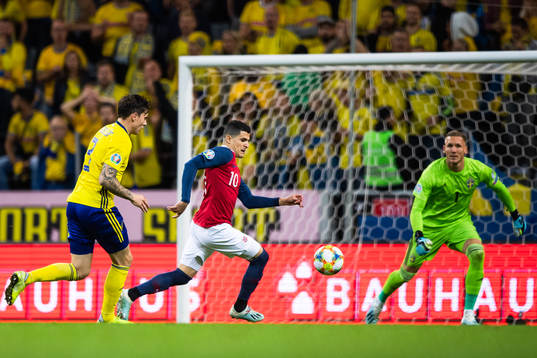 Victor Nilsson Lindelöf of Sweden and Tarik Elyounoussi of