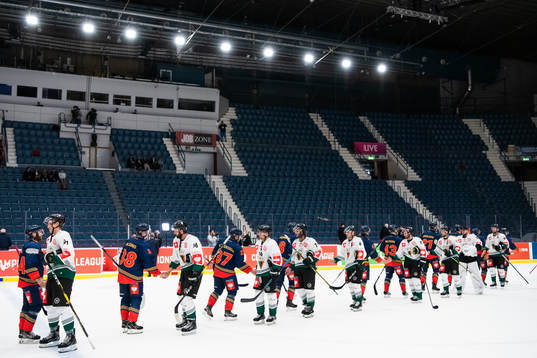 Players of Djurgården and of GKS Tychy shake hands