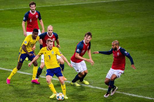 Alexander Isak and Sebastian Larsson of Sweden against