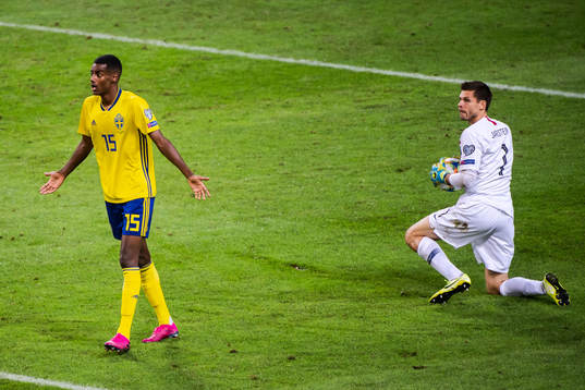 Alexander Isak of Sweden reacts and goalkeeper Rune