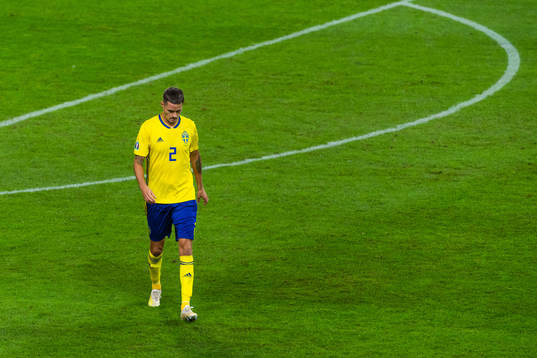 Mikael Lustig of Sweden looks dejected