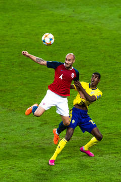 Tore Reginiussen of Norway and Alexander Isak of Sweden