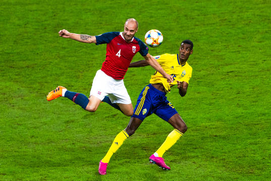 Tore Reginiussen of Norway and Alexander Isak of Sweden