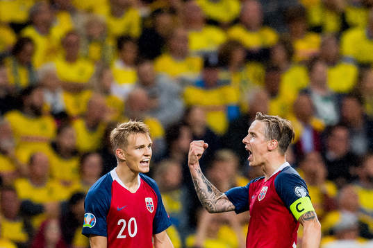 Stefan Johansen of Norway celebrates with teammate Martin