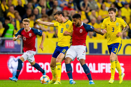 Albin Ekdal of Sweden and Joshua King of Norway