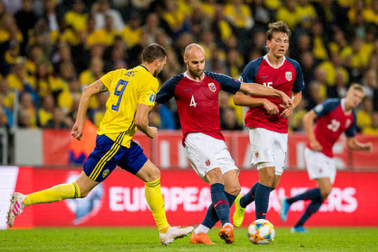 Marcus Berg of Sweden and Tore Reginiussen of Norway
