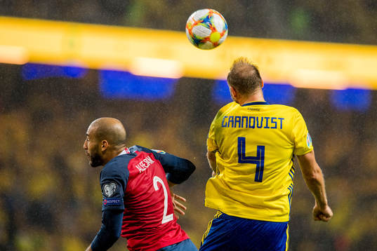 Haitam Aleesami of Norway and Andreas Granqvist of Sweden