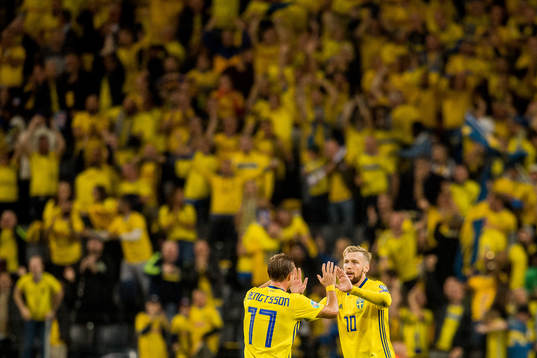 Emil Forsberg of Sweden celebrates with teammate Pierre