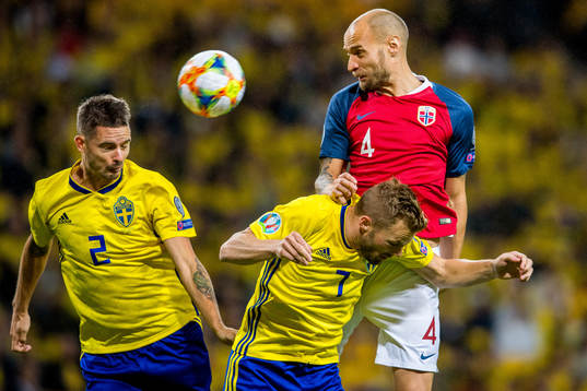 Mikael Lustig of Sweden, Sebastian Larsson of Sweden and
