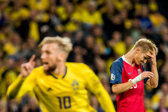 Martin Ødegaard of Norway looks dejected as Emil Forsberg