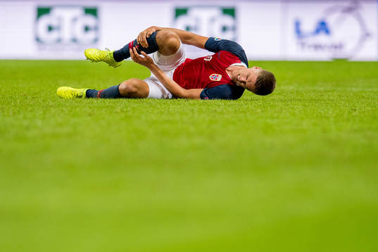 Markus Henriksen of Norway lies down with an injury