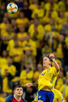 Tarik Elyounoussi of Norway and Kristoffer Olsson of Sweden