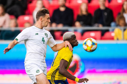Conor Masterson of Ireland and Benjamin Mbunga Kimpioka of