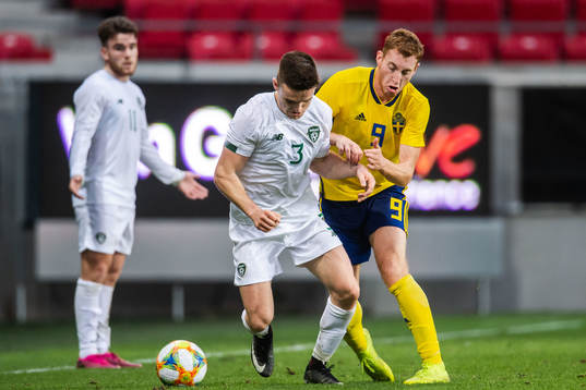 Darragh Leahy of Ireland and Dejan Kulusevski of Sweden