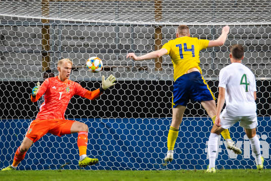 Conor Masterson of Ireland scores 1-1 behind goalkeeper