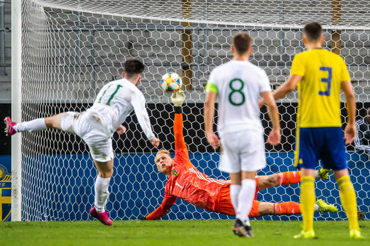 Goalkeeper Pontus Dahlberg of Sweden saves a penalty from