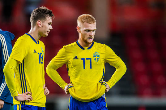 Jake Larsson and Nils Fröling of Sweden look dejected