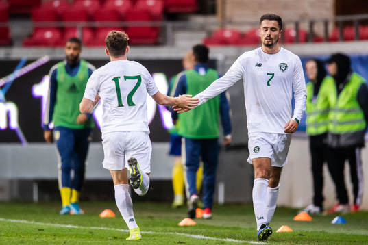Zachary Elbouzedi of Ireland changes with Gavin Kilkenny of