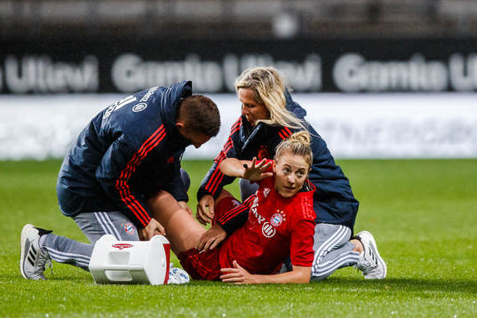 Carolin Simon  of Bayern Munich receives medical treatment