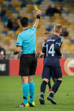 Anders Christiansen of Malmö FF receives a yellow card