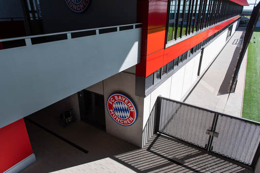 View of a club logo sign at the Bayern Munich Campus Arena