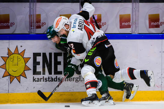 Färjestads Linus Johansson och Malmö Redhawks Niklas Arell