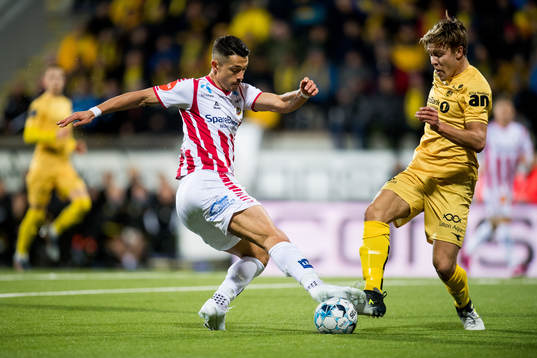 Fitim Azemi of Tromsø and Fredrik André Bjørkan of
