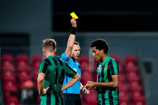 Alfred Richard Scriven of Ull/Kisa gets a yellow card by