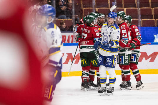Leksands Calle Själin deppar och Frölundas spelarna jublar