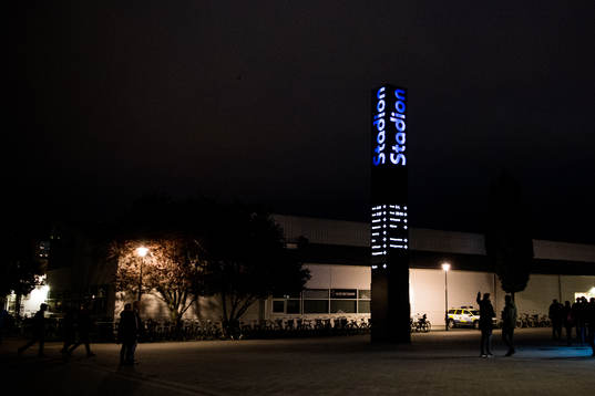 Visitors pass around the entrance to stadion ahead the