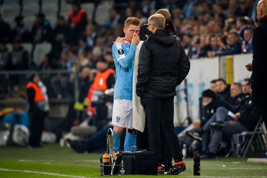 Anders Christiansen of Malmö FF is treaded by doctor Pär