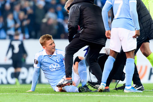 Anders Christiansen of Malmö FF receives medical attention