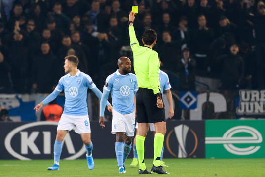 Fouad Bachirou of Malmö FF receives a yellow card