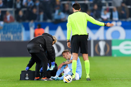 Sören Rieks of Malmö FF receives medical attention