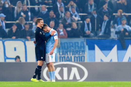 Andreas Bjelland of FC Köpenhamn hugs Markus Rosenberg of