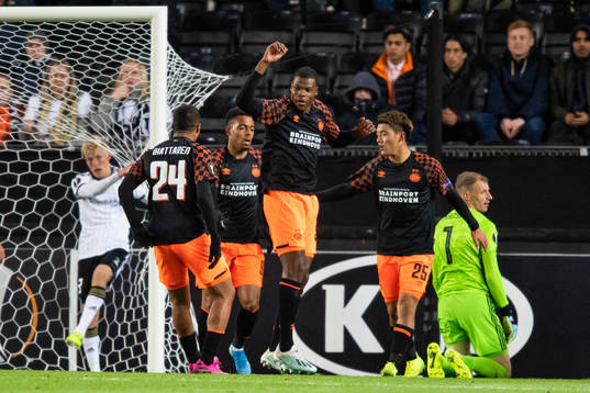 Denzel Dumfries of PSV Eindhoven celebrates scoring 0-2