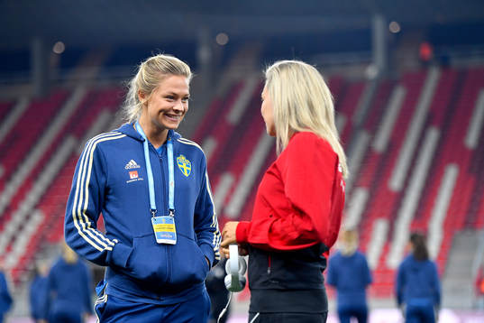 Fridolina Rolfo of Sweden jokes with a Hungarian player