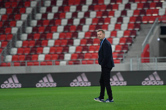 Peter Gerhardsson, head coach of Sweden, inspects the pitch